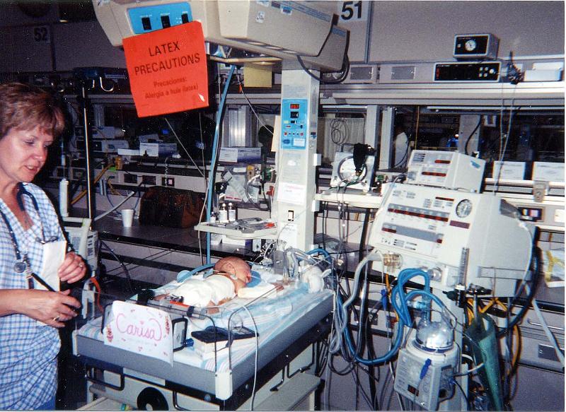 0-04.JPG - Carisa spent 18 days in intensive care. They monitored just about everything they could to make sure she was doing okay. Notice the LATEX PRECAUTIONS sign above. Children with spina bifida often develop an allergy to latex due to the many medical procedures they must undergo.