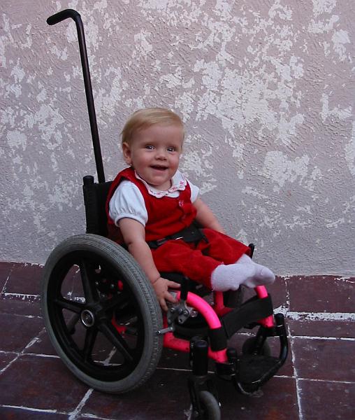 1-08.JPG - Kika with her new "miracle" wheelchair. Esther had found out about it being available via a spina bifida support group and sent a quick email saying that we could use it. We were in Mexico and the family who had it was in Dallas. So we arranged for one of Esther's sisters who lives in Dallas to pick it up for us and keep it until we could pick it up.