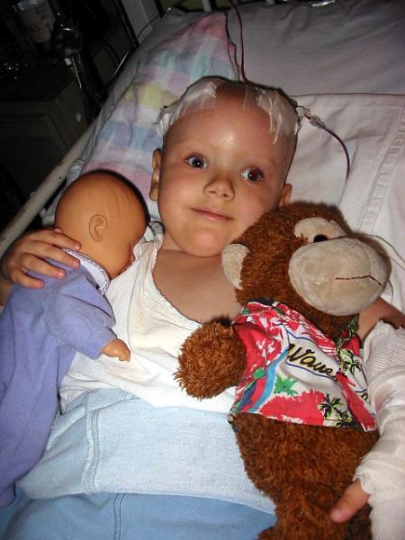 4-18.jpg - Happy to have her dolly and big brother Dave sent his monkey for Kika to play with while in the hospital.