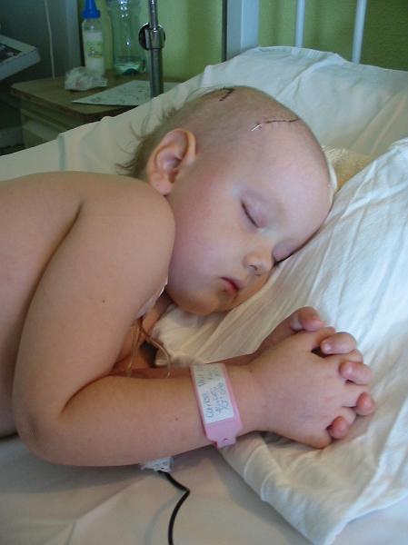 4-21.JPG - Kika's external shunt had come out and she had developed a new infection. We watched her closely, praying desperately that she would improve. But finally, the doctors decided she would need to be operated on to put in another external shunt.