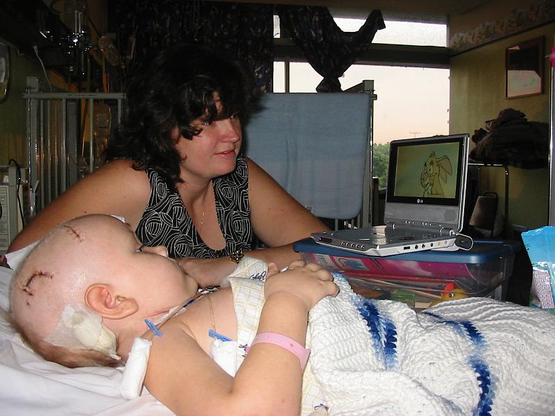 4-24.JPG - Kika's Christmas present, a portable DVD player! After three weeks of being in the hospital, Kika enjoyed having something fun to do watching various programs on her own little player.