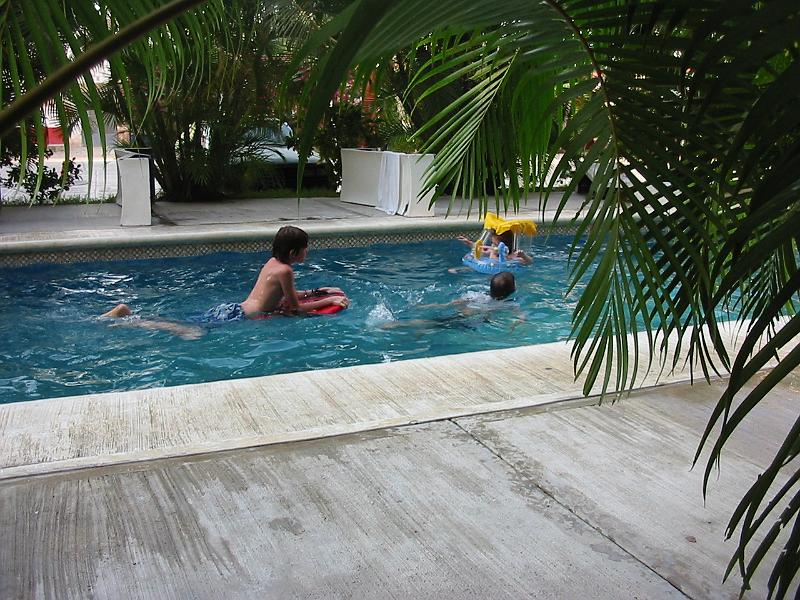 6-09.JPG - We took a vacation to the beach near the end of November. Here are the kids in the swimming pool of the hotel where we stayed.