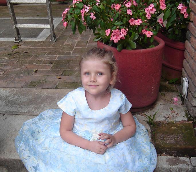 7-04.JPG - Posing by the flowers